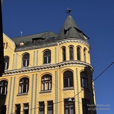 Close-up of the bronze cat on the corner turret of the Cat House, Riga, Latvia