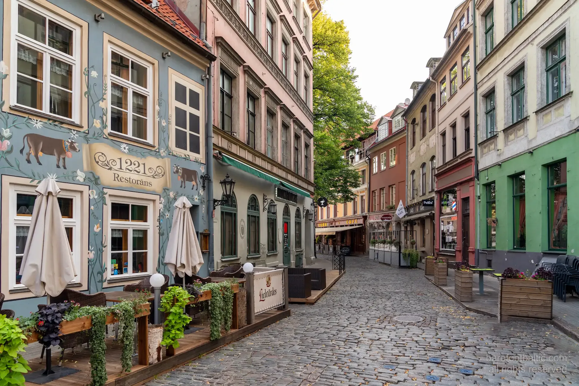 Cobblestone street with restaurants in Riga Old Town, Latvia